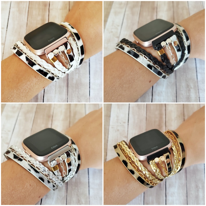 May include: Four different styles of watch bands for a smartwatch. The bands are made of black, white, and gold leather and feature a braided design with metal accents. The bands are shown on a wrist.