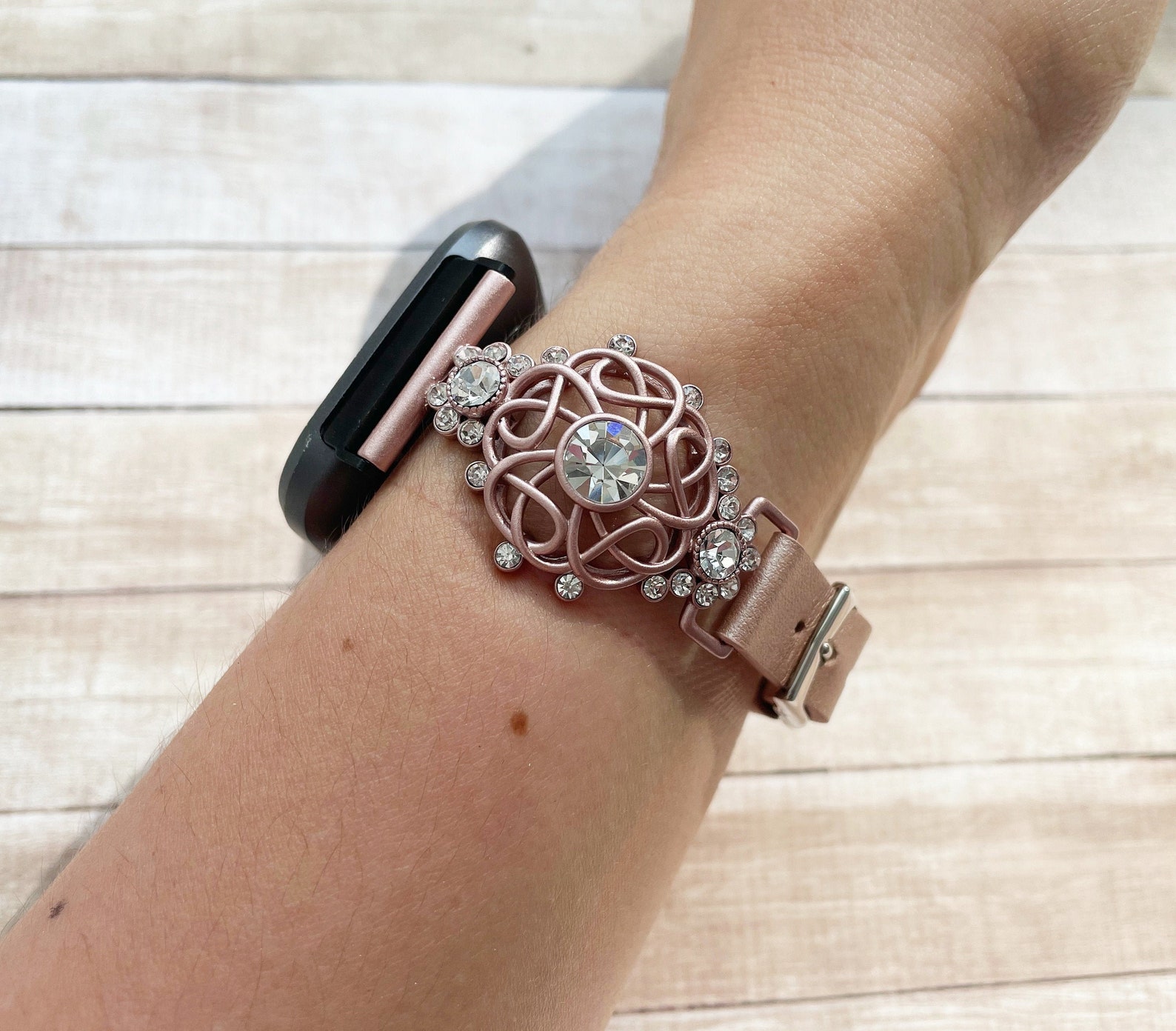 ruby and rose gold fitbit
