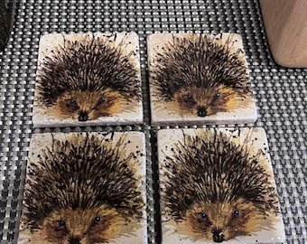 Handmade decoupage hedgehog coasters on travertine stone