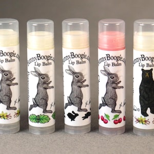May include: Six different flavored lip balms in tubes with bunny and bear illustrations. The lip balms are labeled "Bunny Boogie.com Lip Balm".