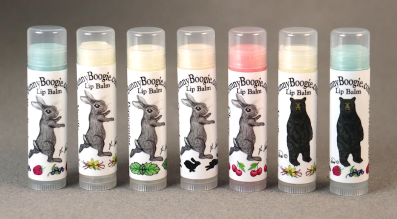 May include: Six different flavoured lip balms in tubes with bunny and bear illustrations. The lip balms are labelled "Bunny Boogie.com Lip Balm".