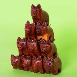 Handcarved wooden pocket pig figure