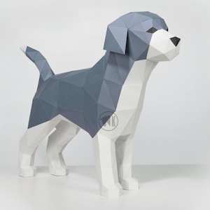May include: A papercraft model of a dog, made of white and gray paper. The dog is standing on a white surface.