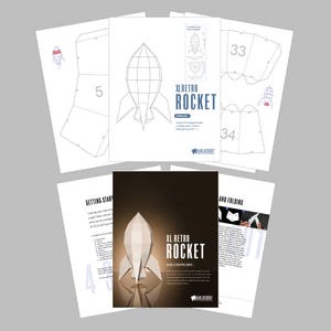 May include: A paper model kit for building a large retro rocket. The kit includes instructions and templates for cutting and folding the paper to create a 3D model. The rocket is white with red and blue accents. The kit is titled "XL Retro Rocket".
