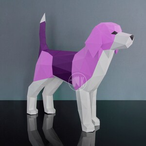 May include: A papercraft model of a beagle dog, with a pink and purple color scheme. The dog is standing on a black surface.