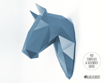 May include: A blue papercraft horse head model. The model is made of folded paper and has a geometric design. The model is a 3D representation of a horse's head.