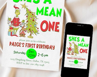 Pode incluir: Um convite de aniversário com o texto "SHE'S A MEAN ONE" em verde e vermelho. O convite apresenta um personagem de desenho animado do Grinch e uma árvore de Natal. Um smartphone exibe o mesmo convite. O convite é para o primeiro aniversário de Paige.