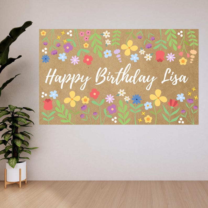 May include: A rectangular banner with a kraft paper background, adorned with colorful flowers and green leaves. The words "Happy Birthday Lisa" are written in white script across the center. The floral design includes red, yellow, blue, and purple flowers.