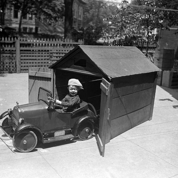 1925 Young Boy in Pedal Car with Garage Vintage Photograph 8.5" x 11"