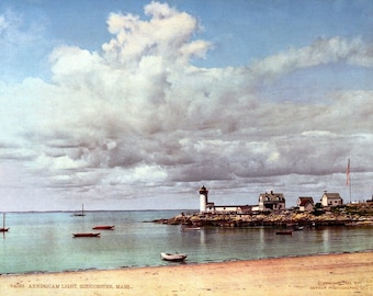 May include: A postcard depicting a lighthouse on a rocky island with a small village in the background. The sky is cloudy and the water is calm. The text on the postcard reads "54068 ANNISQUAM LIGHT, GLOUCESTER, MASS."