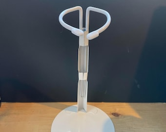 Large doll stand for dolls approximately 18 inches tall.  Metal Doll Stand, adjusts 9-15 inches, Display stand for larger dolls.
