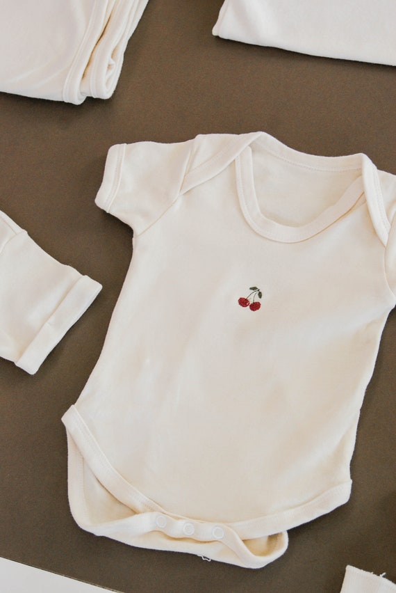 cream baby bodysuit