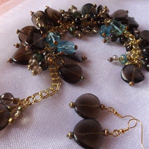SMOKY QUARTZ, AQUAMARINE, brown agates, blue vintage glass, brown faceted crystals, a very unusual bracelet w/ smoky quartz earrings.