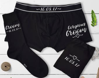 May include: Black boxer shorts with a white waistband and the text "~16.08.17~" and "Gorgeous Groom ~♡~". A black sock with the text "Groom ~16.08.17~" and a black drawstring bag with the text "~♡~ 16.08.17"