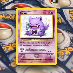 May include: A purple Gengar Pokemon card with a baby Gengar illustration. The card has a pink background with white stars. The card text reads "New Baby Pokemon Gengar 2023 HP".