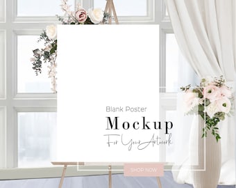 May include: A blank white poster mockup on an easel with flowers in vases on either side of the poster. The poster is in front of a window with white curtains. The text on the poster reads "Blank Poster Mockup For Your Artwork Shop Now".