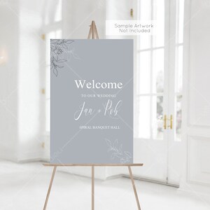 May include: A light blue welcome sign with white text and floral designs. The sign reads "Welcome to our wedding Jan + Rob Spiral Banquet Hall".
