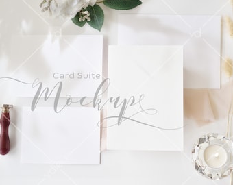 May include: A mockup of a card suite with two white cards, a white envelope, and a wax seal. The text "Card Suite Mockup" is written in gray cursive on the larger card.