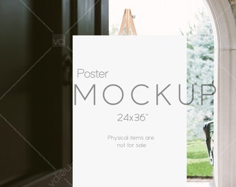 May include: A white poster mockup on an easel with the text "Poster Mockup 24x36" and "Physical items are not for sale".
