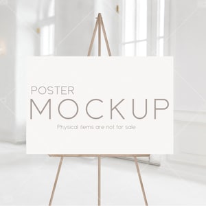May include: A white poster mockup on a wooden easel. The poster has the text "POSTER MOCKUP" and "Physical items are not for sale".
