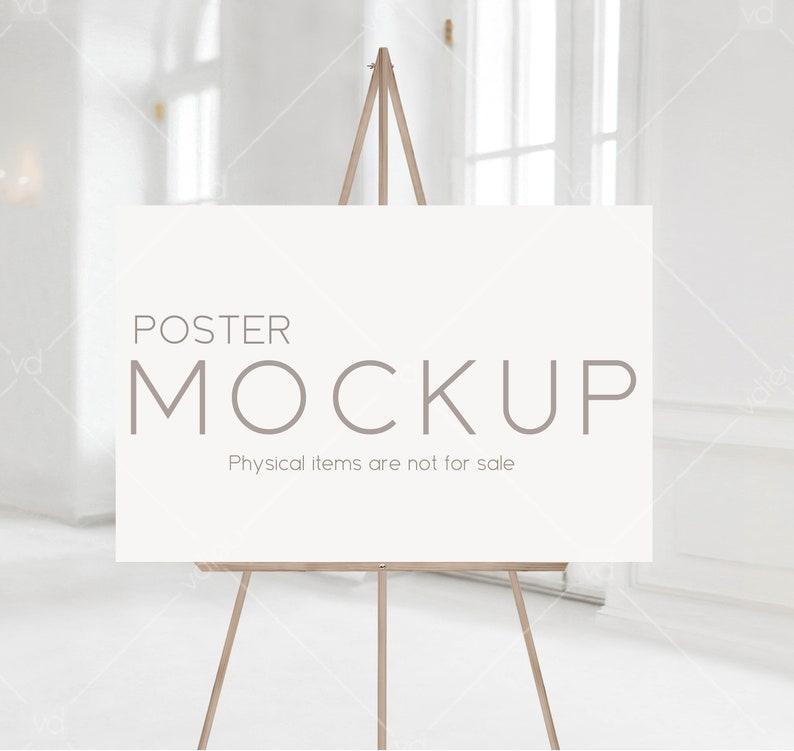 May include: A white poster mockup on a wooden easel. The poster has the text "POSTER MOCKUP" and "Physical items are not for sale".