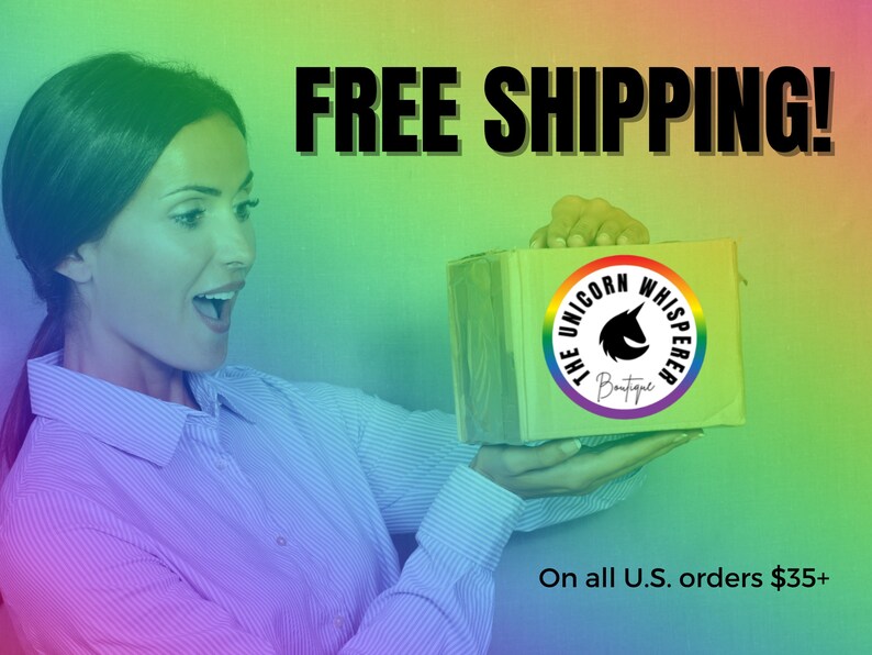 May include: A rectangular cardboard shipping box featuring a circular logo with a black unicorn silhouette and the text The Unicorn Whisperer Boutique, set against a vibrant rainbow gradient background with bold black text.
