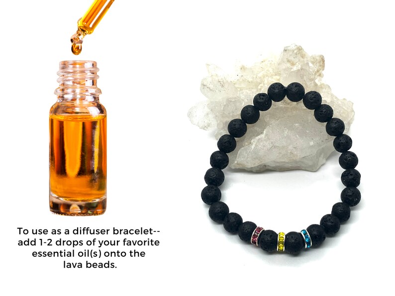 A black lava rock bracelet with pink, yellow and blue rhinestones. The bracelet is on a white surface. A bottle of essential oil and a dropper are shown to the left of the bracelet. Text reads: 'To use as a diffuser bracelet-- add 1-2 drops of your favorite essential oil(s) onto the lava beads.'