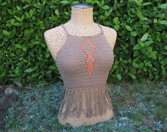 May include: A brown crocheted halter top with a geometric design in orange thread. The top has a fringe trim.