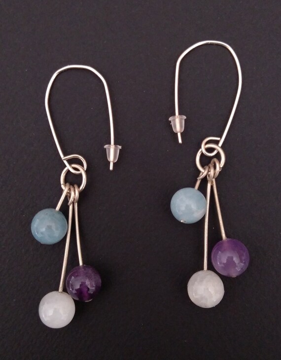 Hanging earrings in silver and fine stones