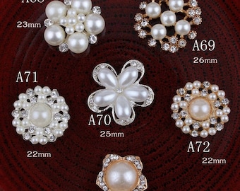 May include: Assortment of ten pearl and rhinestone embellishments in various shapes and sizes. The embellishments are in gold and silver tones. The embellishments are labeled A68, A69, A70, A71, A72, and A73. The embellishments are 20mm, 22mm, 23mm, 25mm, and 26mm in size.