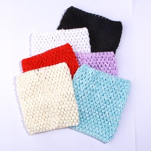May include: A set of six crochet headbands in various colours, including white, red, light blue, lavender, black, and cream.