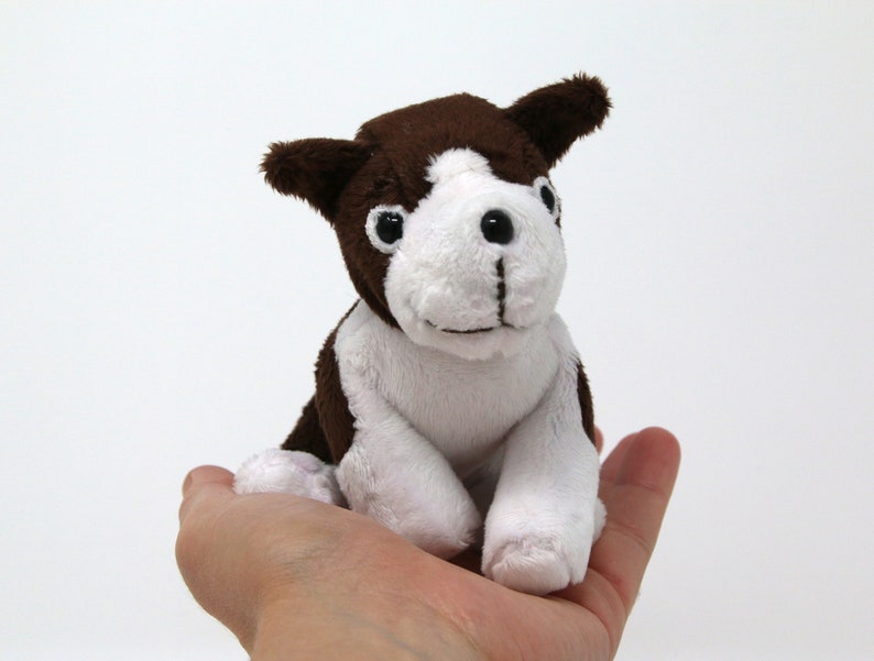 brown and white stuffed puppy