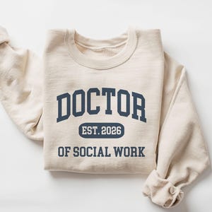 Sweat-shirt docteur en travail social, assistante sociale personnalisée, cadeau de remise des diplômes d'un étudiant en doctorat, col rond unisexe