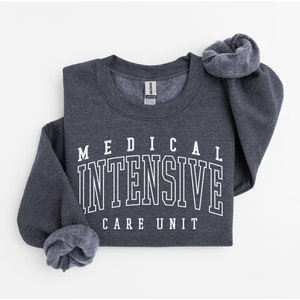 May include: A dark heather gray sweatshirt with white text that reads "MEDICAL INTENSIVE CARE UNIT".