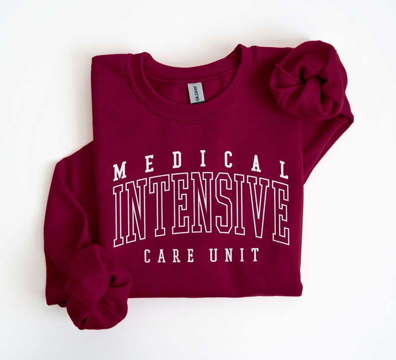 May include: Burgundy sweatshirt with white text that reads "MEDICAL INTENSIVE CARE UNIT".