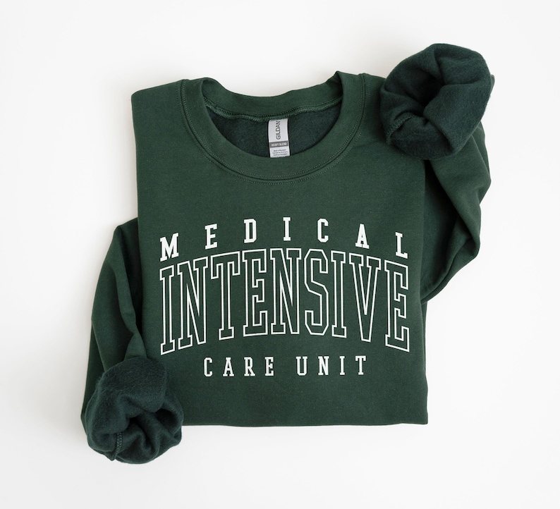 May include: A dark green sweatshirt with white text that reads "MEDICAL INTENSIVE CARE UNIT".