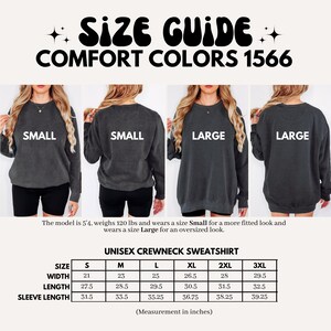 May include: Size chart for a unisex crewneck sweatshirt in Comfort Colors 1566. The chart shows measurements in inches for width, length, and sleeve length for sizes S, M, L, XL, 2XL, and 3XL.