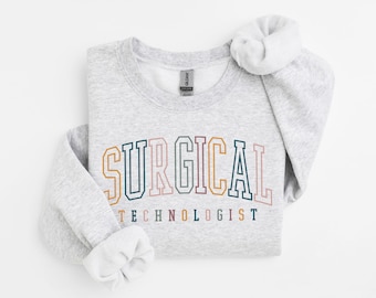 May include: Gray sweatshirt with the text "SURGICAL TECHNOLOGIST" in colorful block letters.
