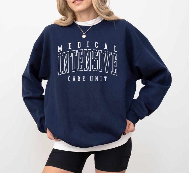 May include: A navy blue sweatshirt with the text "MEDICAL INTENSIVE CARE UNIT" in white.