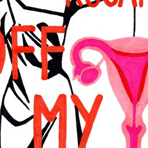 A macro detail shot of the "Keep Your Rosaries Off My Ovaries" artwork, showing the hand-drawn texture of the red marker lettering and the vibrant pink shades used for the ovaries illustration.