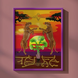 May include: A framed art print featuring two brown lions standing on their hind legs facing each other. Between them is a green Venus flytrap plant against a yellow sun and a red and orange sunset sky. Below, gold line art depicts roots.