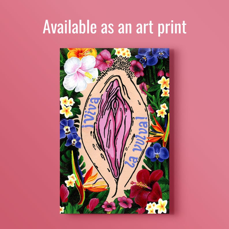 A vertical art print featuring a stylized, pink vulva surrounded by a lush border of tropical flowers like hibiscus, orchids, and birds of paradise. The text "¡Viva la vulva!" is written in blue. Above it, white text reads "Available as an art print."