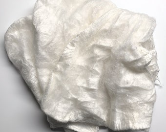 May include: A white, crinkled, sheer fabric with a slightly textured surface.