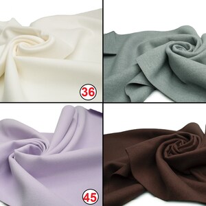 May include: Four fabric swatches in different colors: white, light blue, lavender, and brown. Each swatch is folded and arranged in a spiral shape. The numbers 36, 44, 45, and 49 are printed on the bottom right corner of each swatch.