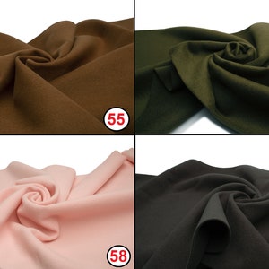 May include: Four fabric swatches in different colors: brown, green, pink, and black. The swatches are arranged in a grid pattern, with the numbers 55, 56, 58, and 61 printed on each swatch.