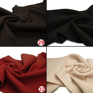May include: Four fabric swatches in different colors: brown, black, red, and beige. The swatches are arranged in a grid pattern, with the numbers 29, 30, 32, and 35 printed in red circles in the bottom right corner of each swatch.