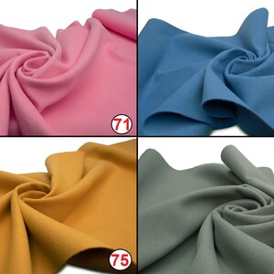May include: Four fabric swatches in different colors: pink, blue, yellow, and gray. The swatches are folded and arranged in a grid pattern.