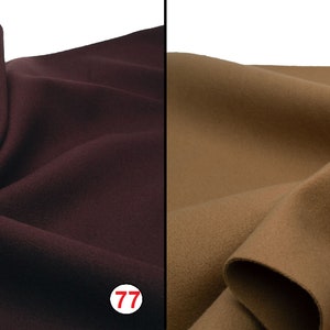 May include: Two fabric swatches, one a deep burgundy red and the other a light brown. Both swatches are folded and arranged in a spiral shape.