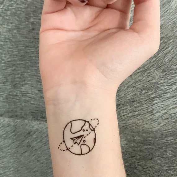 world tattoo on wrist