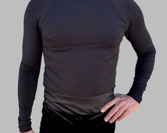 May include: A black long-sleeved mock neck shirt with a fitted silhouette.